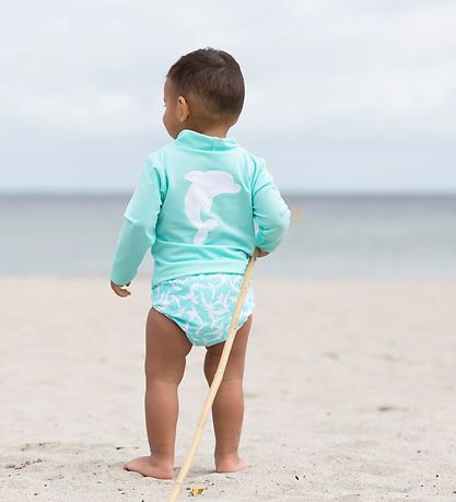 Petit Crabe Swim Diaper - Leo - UV50+ - Mint w. Dolphins Petit Crabe Swim Diaper - Leo - UV50+ - Mint w. Dolphins